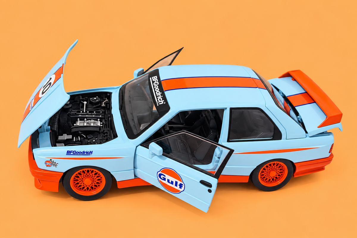 1:24 Scale Die-Cast Metal 1982 B.M.W M3-E30 Car with Openable Doors, Pull Back Action,Lights,Music & Working Steering【Pack of 1】 (Sky Blue-Orange)